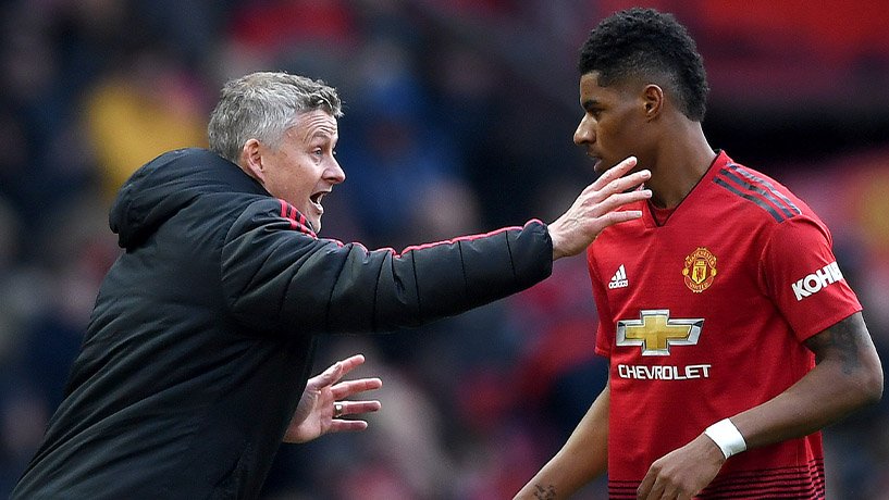 Rashford and Ole Gunnar Solskjær celebrating a scored goal for Manchester United.